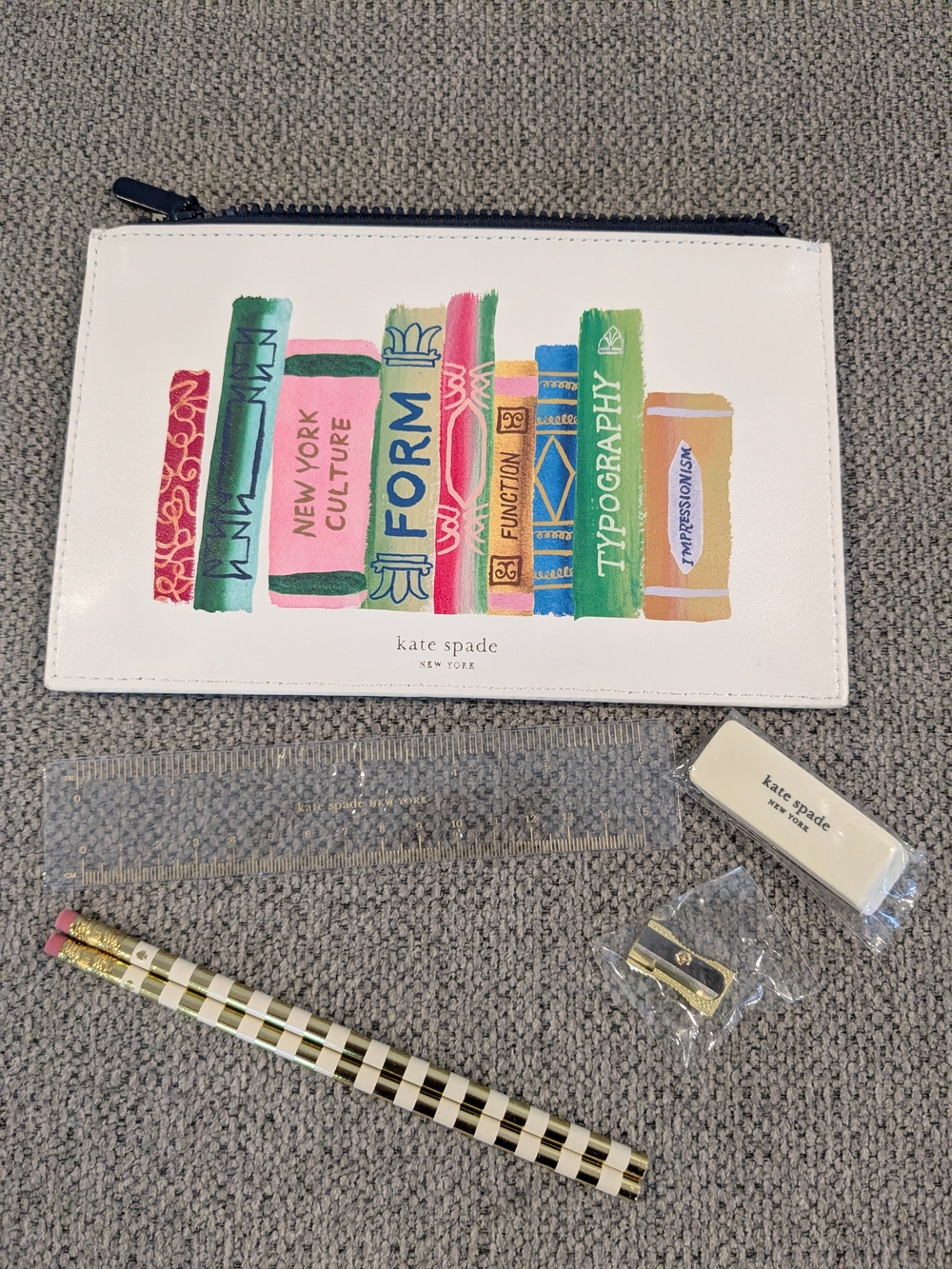 kate spade White Pouch with Multicolor Book Spine Print